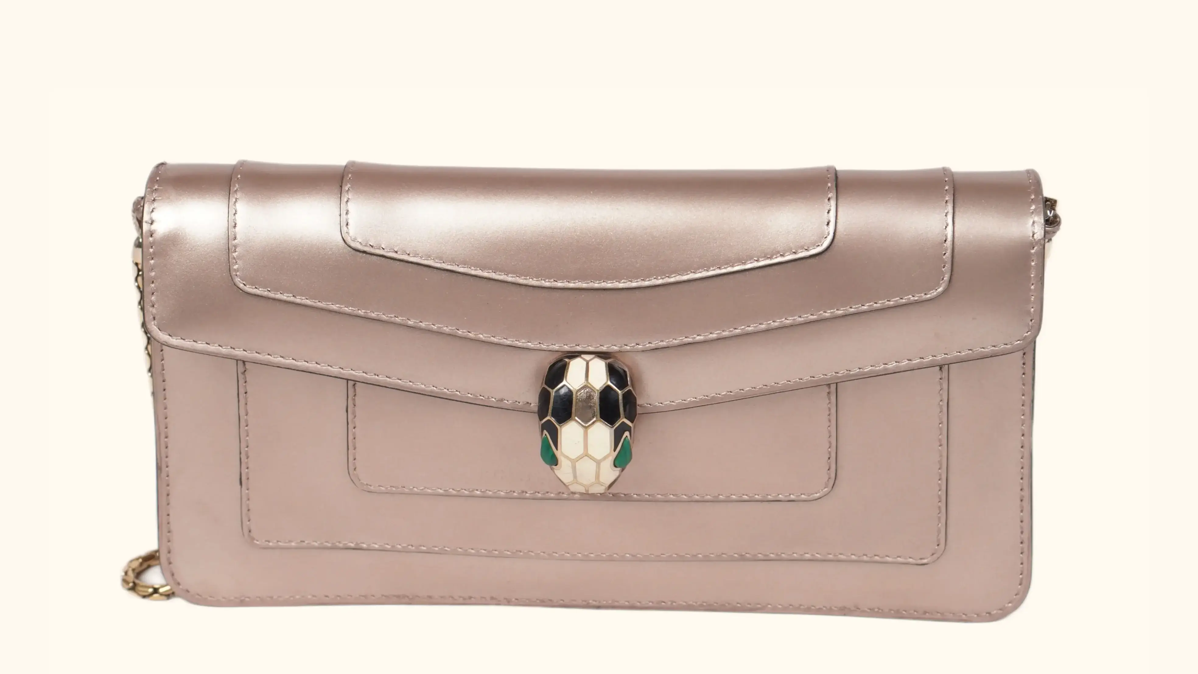 Before Bvlgari clutch restoration oxidized metallic surface with faded tone