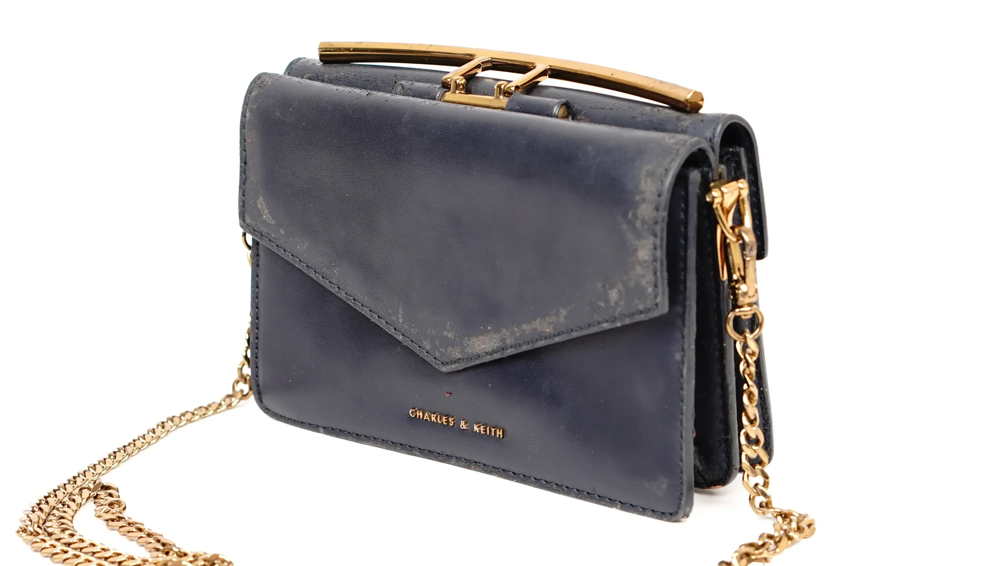 After Charles & Keith sling bag restoration rich, uniform colour with smooth finish