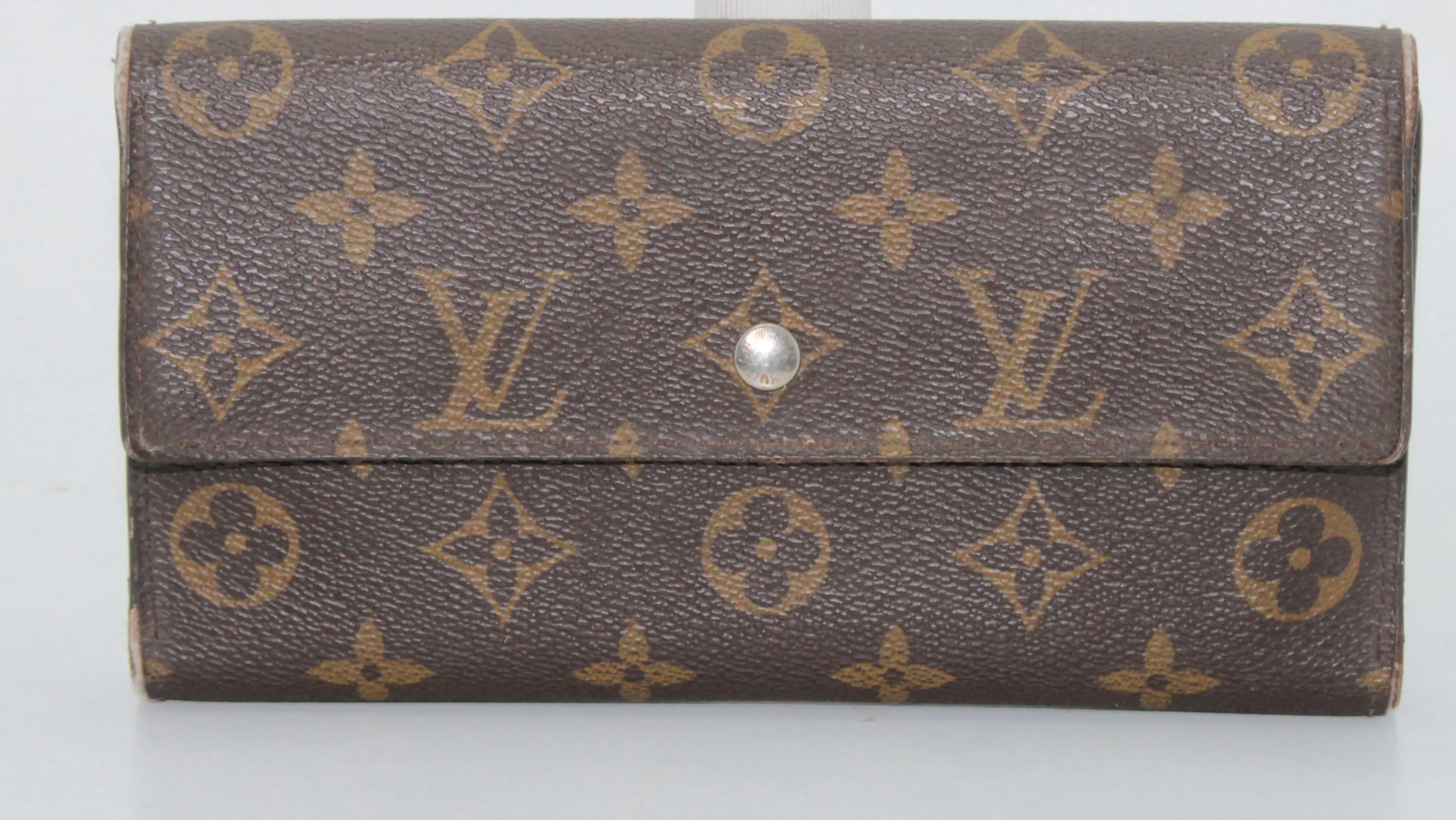 After Louis Vuitton purse restoration smooth, rejuvenated finish with elegant lustre